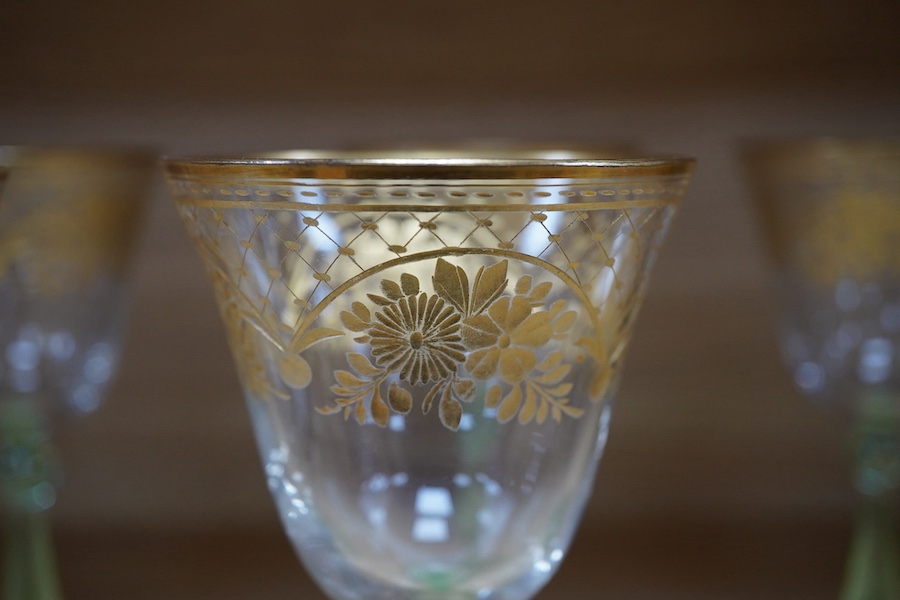 A set of six Bohemian wine glasses with ornate gilt decorated bowls, height 19cm. Condition - good